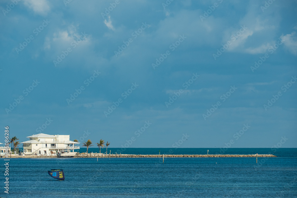 Beach house at the Florida Keys with a pier in front to the ocean