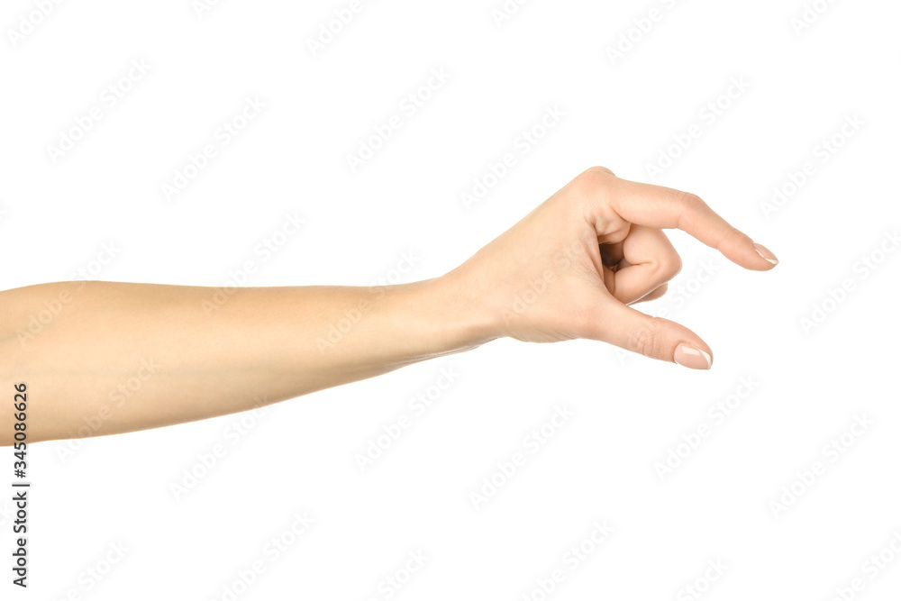 Measuring invisible item. Woman hand gesturing isolated on white Measuring invisible item. Woman hand gesturing isolated on white