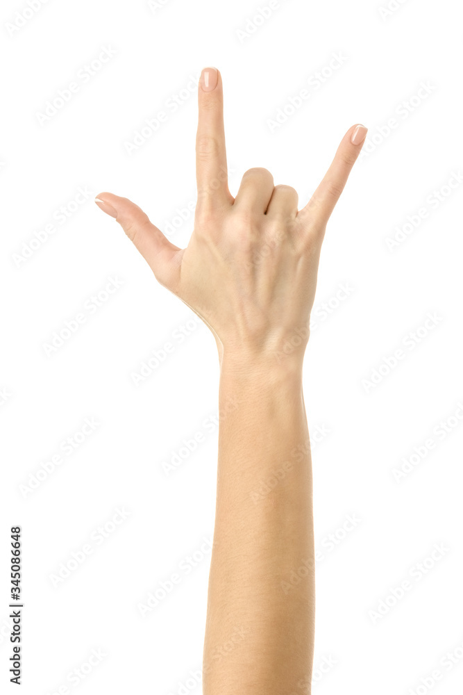 Rock and roll! Woman hand gesturing isolated on white Rock and roll! Woman hand gesturing isolated on white