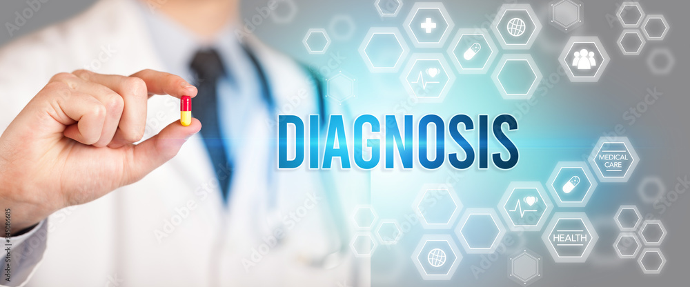 Close-up of a doctor giving you a pill with DIAGNOSIS inscription, medical concept Close-up of a doctor giving you a pill with DIAGNOSIS inscription, medical concept