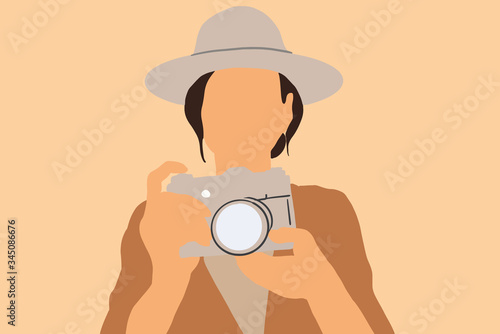 Female traveler with a photo camera on the background