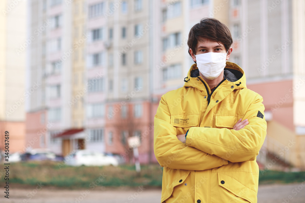 man standing outdoors wearing medical mask to protect others from virus spread man standing outdoors wearing medical mask to protect others from virus spread