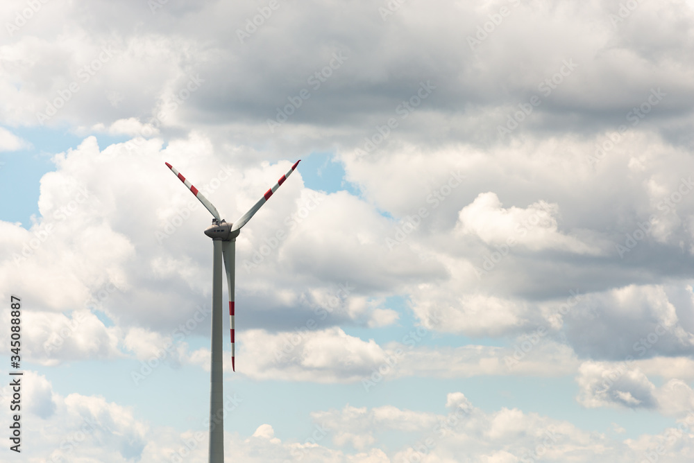 Wind generator against the sky in Austria. The wind generates electricity for us. The blades of a large propeller. Wind generator against the sky in Austria. The wind generates electricity for us. The blades of a large propeller.