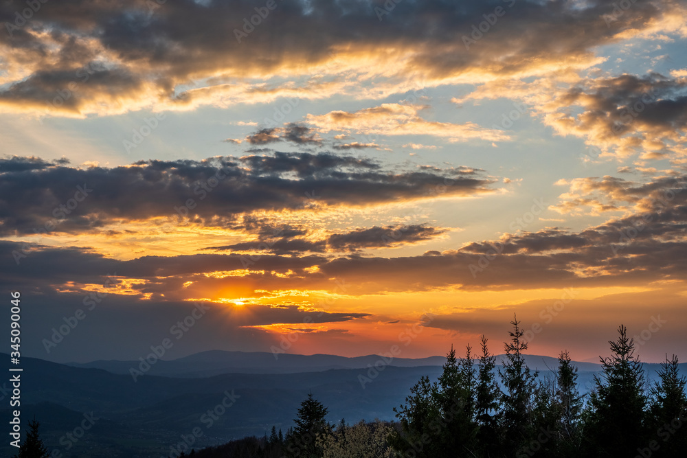 Obraz premium sunrise in the mountains with forest in the foreground with beautiful sky, czech republic beskydy Javorovy vrch