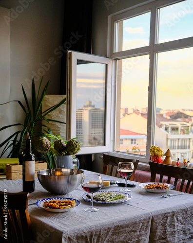Lunch table with Tagliatelle Pasta with Bolognese Sauce, Baked Asparagus, parmesan cheese, salad and red wine