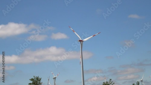 Wind generator against blue sky background