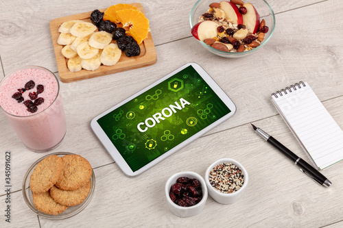 Healthy Tablet Pc compostion with CORONA inscription, immune system boost concept