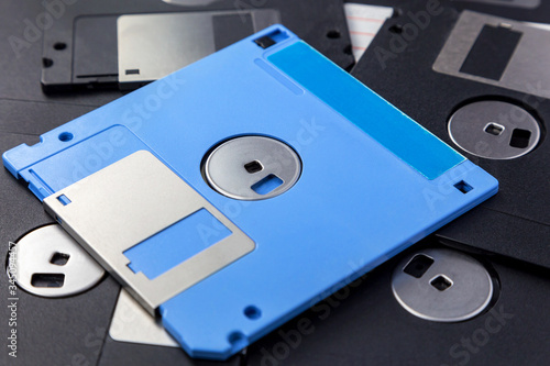 Blue and black 3.5 inch floppy disks as background