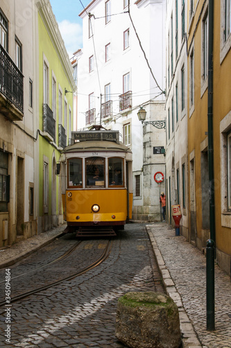 Cable car in a narrow street in Lisbon