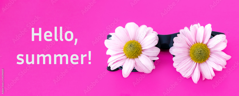 Sunglasses with pink chrysanthemum flowers instead of glasses and inscription HELLO,SUMMER! on a pink background.Summer is coming concept