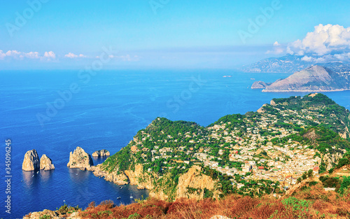 Faraglioni cliffs in Tyrrhenian Sea of Capri Island reflex