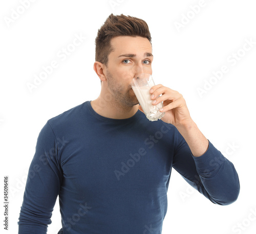 Young man with glass of mil...
