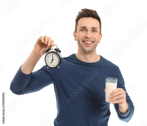 Young man with glass of mil...