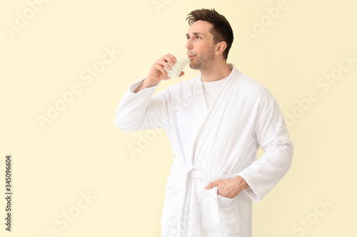 Young man with glass of mil...