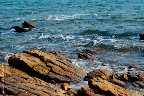  The seashore has beautiful rocks. And the sea wave