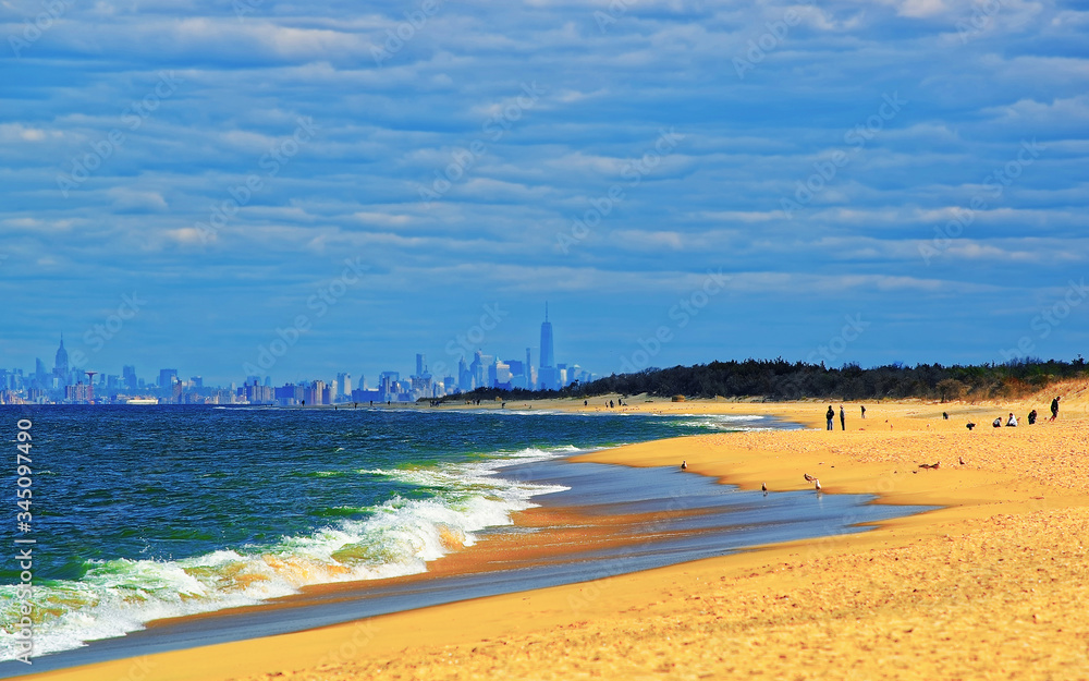 Atlantic Ocean shore at Sandy Hook with view of NYC reflex