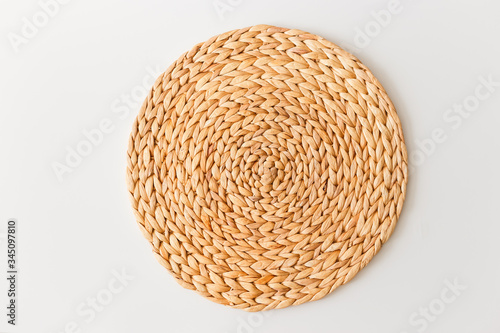 Wicker straw stand isolated on white background. Flat lay, top view minimal social media template photo