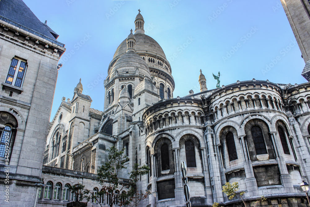 Cathedral of the Sacre Coeur. The dome, arches, balustrades, and mullioned Windows. France. Paris. Grey.