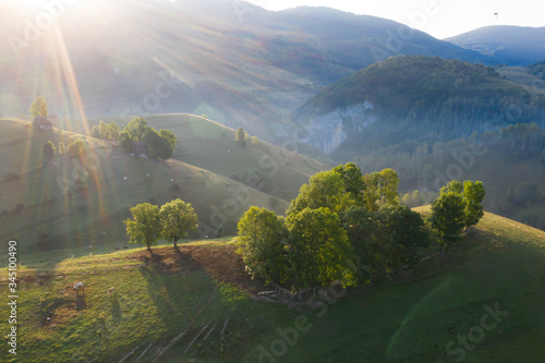 Drone view of beautiful summer sunrise over Transylvanian mountains. © erika8213