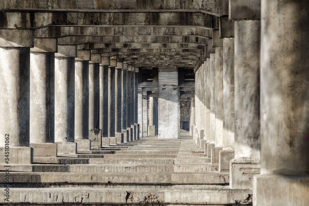 Antique colonnade. Stone pillars and stairs. Ancient colonnade Antique colonnade. Stone pillars and stairs. Ancient colonnade