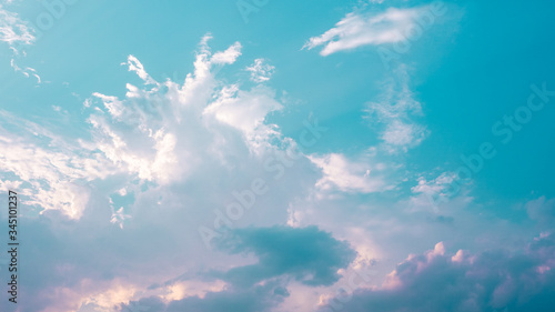 Beautiful clouds in blue sky background. Puffy and brilliant white clouds before sunset. Sky and clouds background