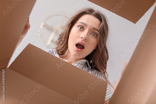 Troubled woman with open bo...