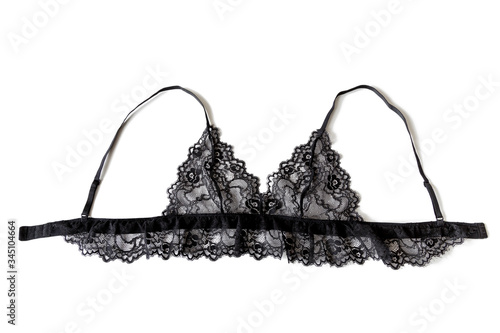 Close-up of a sexy black see-through lacy bralette bra, isolated on white background.