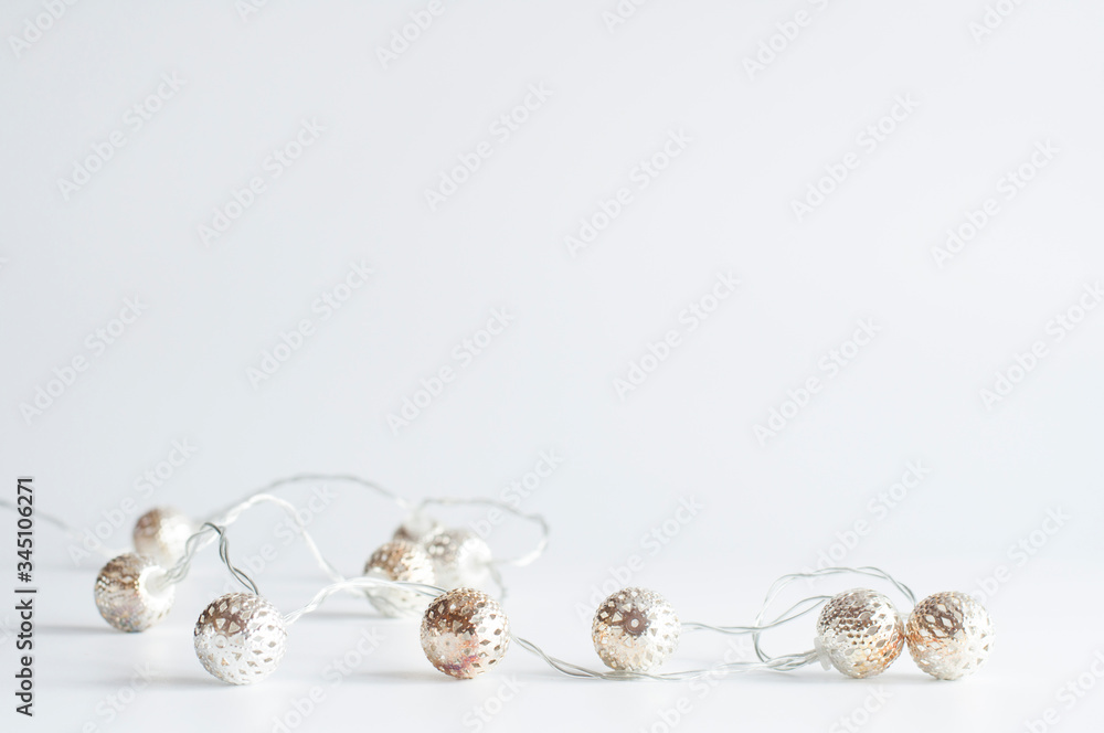 Fototapeta premium Garland on a white background. Decorative decoration.