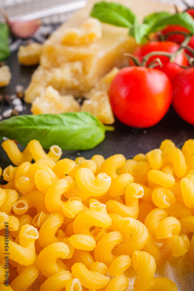 concept of traditional italian pasta with tomatoes and basil