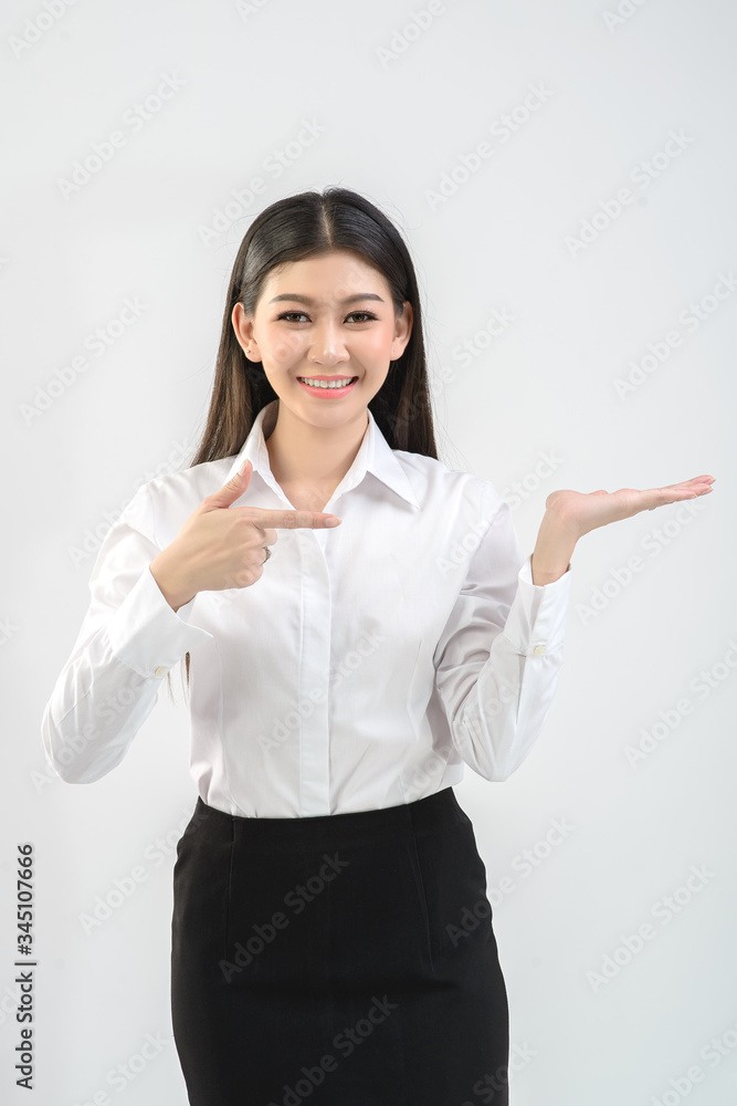 Office girl, online merchant is offering products on white background. Business, online trading, presenter concept. Office girl, online merchant is offering products on white background. Business, online trading, presenter concept.