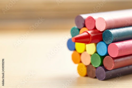 Colorful crayon on wooden table