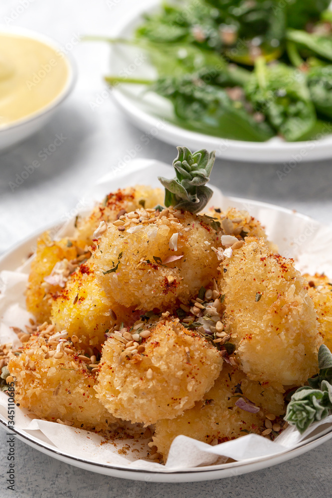 Fried small cheese mozzarella balls breaded in panko Fried small cheese mozzarella balls breaded in panko