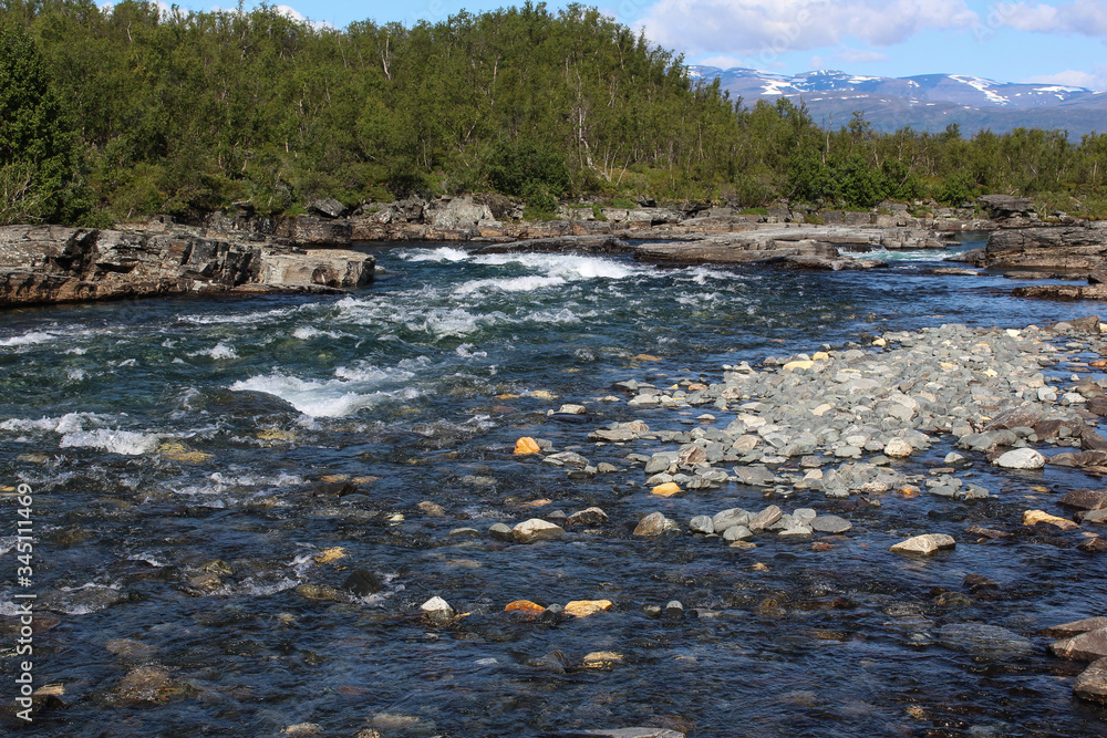 Kungsleden river in the arctic tundra. Abisko national park, Nothern Sweden Kungsleden river in the arctic tundra. Abisko national park, Nothern Sweden