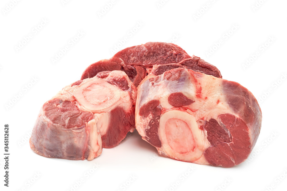 Three slices of fresh shank steak on a white background. Fresh Osso Buco steaks.
