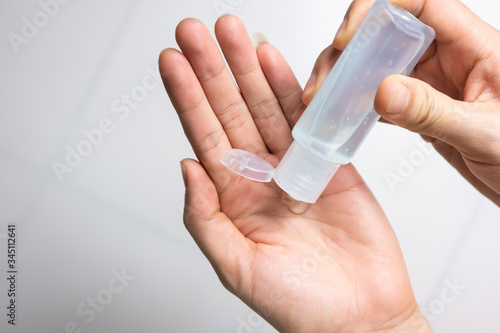 Man using hand sanitizer wash gel for protection coronavirus (covid-19) and germ, health care concept