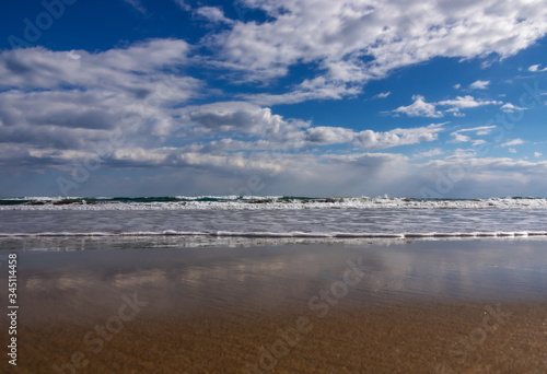 Empty Beach  Sea  Sand and Cloudy Sky  Calmness and Nature Concept  