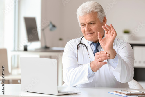 Male doctor giving a consul...