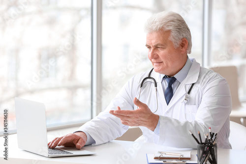 Male doctor giving a consul...