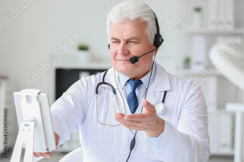Male doctor giving a consul...
