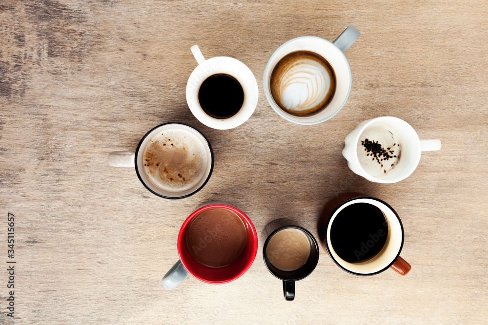 Many cups of coffee on wooden table, top view Many cups of coffee on wooden table, top view
