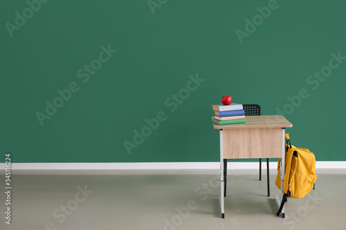 Modern school desk near col...