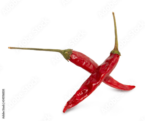 Dried red hot peppers isolated on white. photo