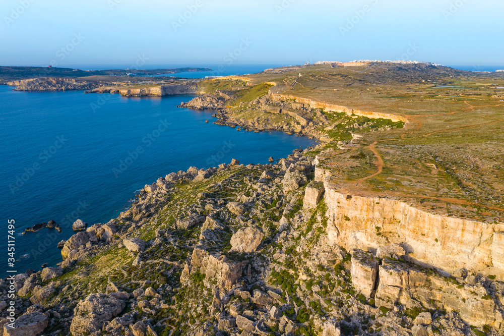 Aerial view of nature cliffs. Mediterranean sea, evening, sunset. Malta island