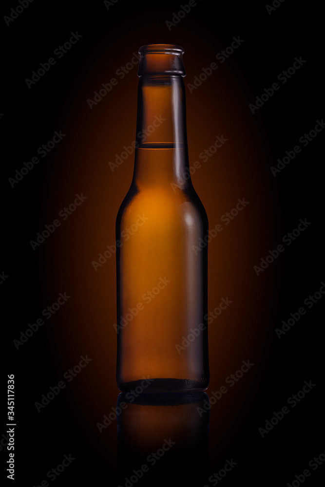 Brown small bottle full of liquid on a black background Brown small bottle full of liquid on a black background