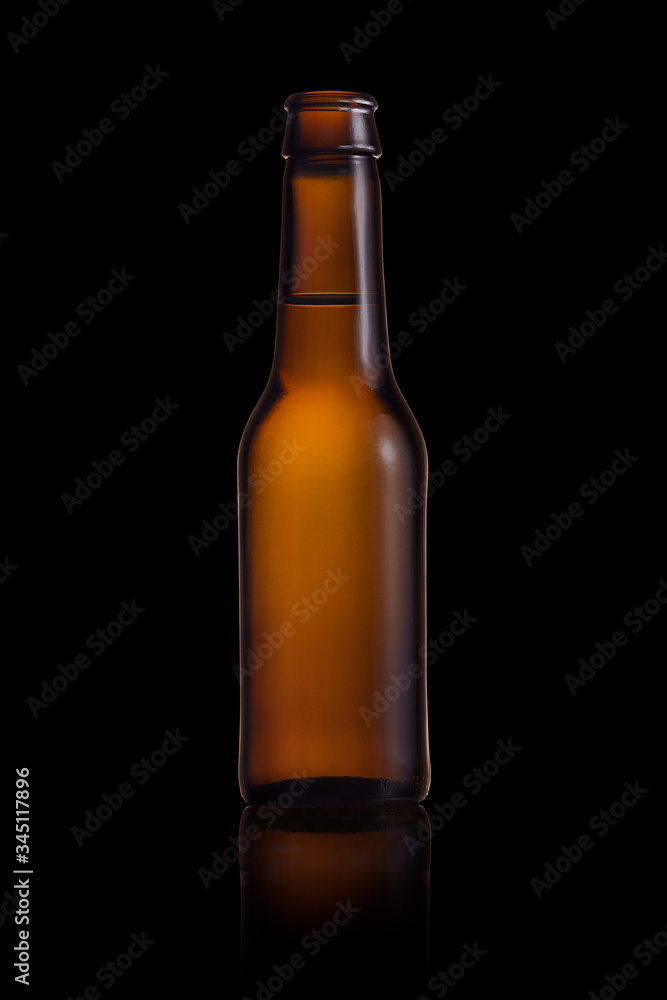 Brown small bottle full of liquid on a black background Brown small bottle full of liquid on a black background