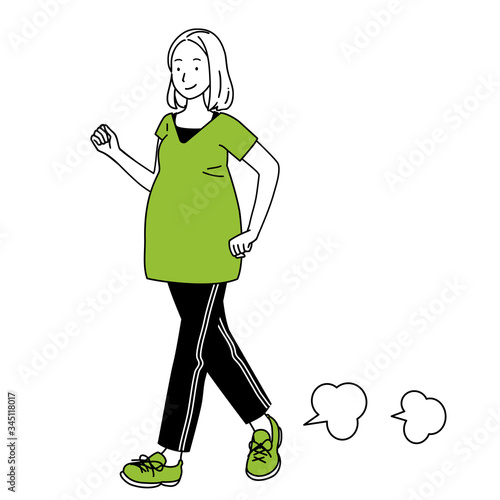 A pregnant woman walking.