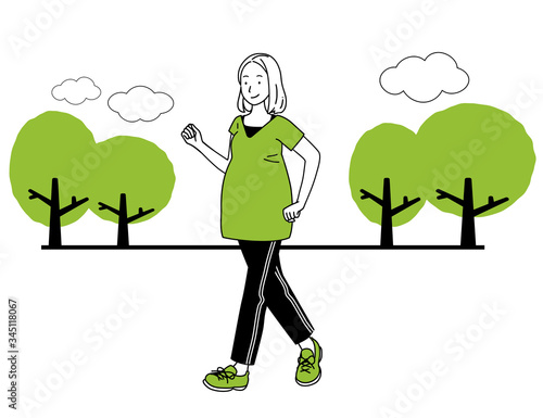 A pregnant woman walking.