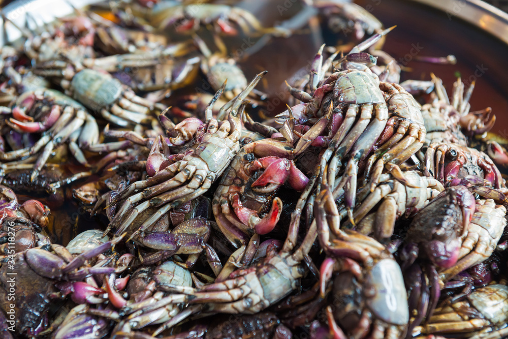 Heap of fresh cooked salted crabs at asian seafood market Heap of fresh cooked salted crabs at asian seafood market