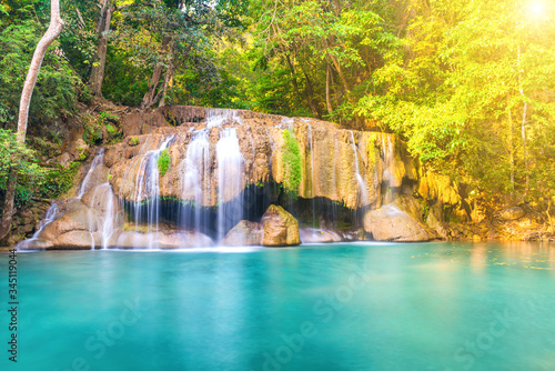 Waterfall landscape with beautiful emerald lake and green tree in wild jungle forest. Erawan National park, Thailand © Pavlo Vakhrushev