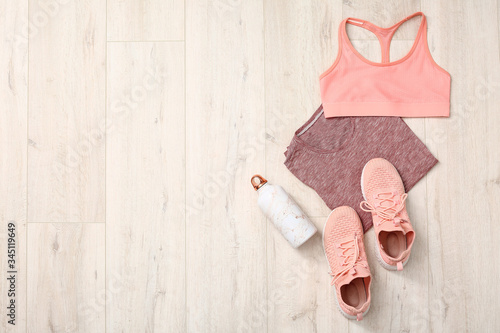 Tableau sur toile Composition with sportswear on wooden background